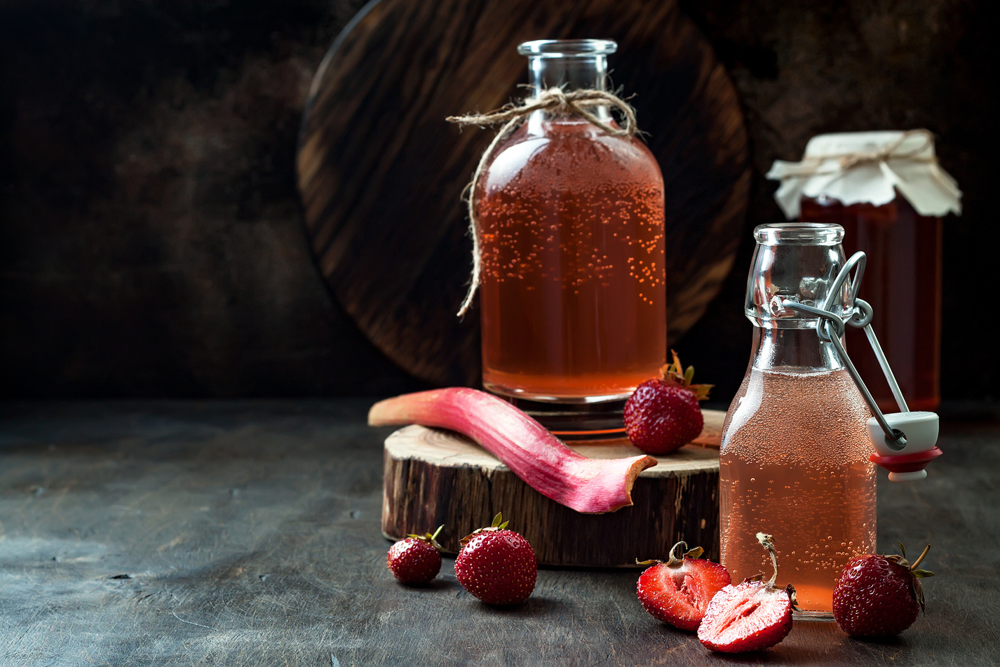 Homemade fermented strawberry and rhubarb kombucha. Healthy natural probiotic flavored drink